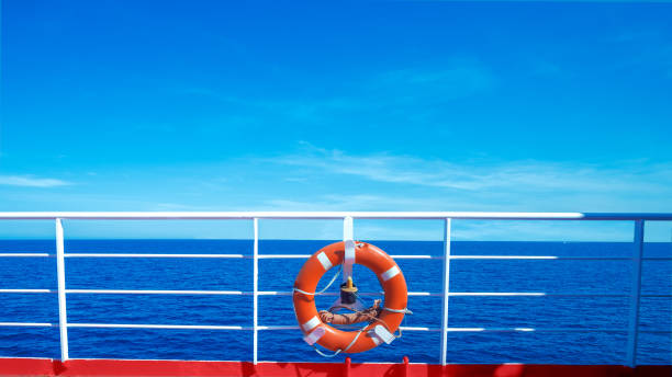 istock Life preserver on deck on sea background 1241692957