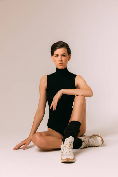 istock young woman doing stretching and gymnastic exercises 1241706871