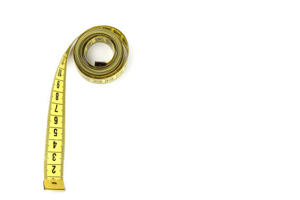 istock Yellow measuring tape twisted, isolated on a white background 1241710167