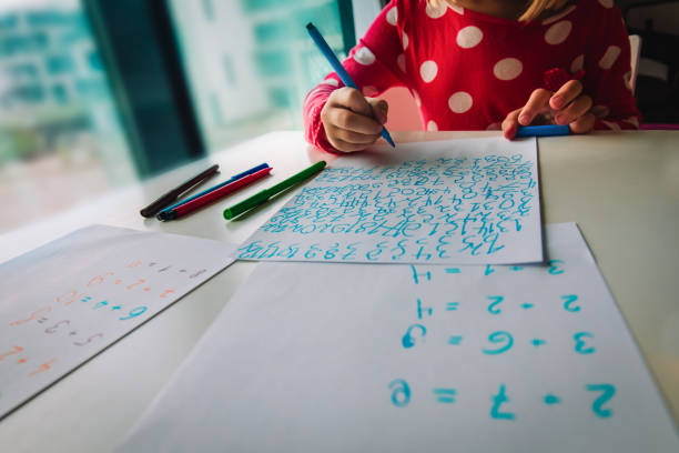 little girl calculating numbers, kid doing homework, math for kids, learning at home
