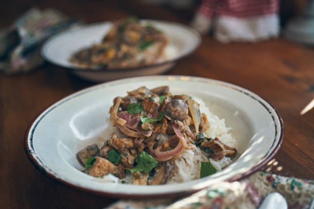 Preparing Vegan Mushroom Stroganoff Served with Rice