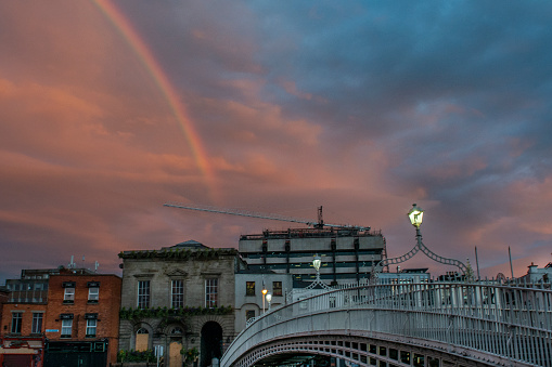 Dramatic sunset and rainbow over Dublin City during Covid 19 global pandemic, Ha'penny Bridge, Dublin, Ireland.