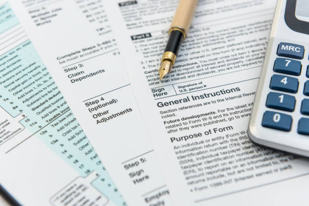 istock Tax Forms with Calculator and Pen. Financial accounting 1241734093