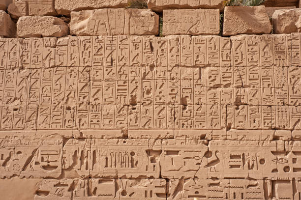 istock Hieroglyphic carvings on an ancient egyptian temple wall 1241735719