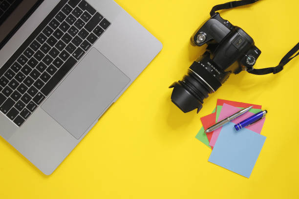 istock Photographer's desk with paper stickers. 1241738114