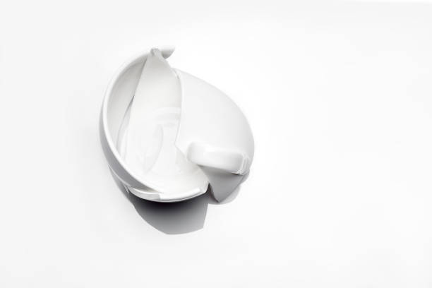 istock broken white ceramic tea cup on a white background top view, conceptual photo with a shattered object. 1241745702