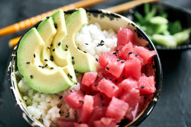 Sliced raw tuna, rise and avocado in bowl