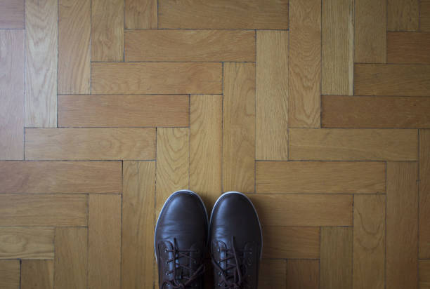 istock Man shoes concept wooden background 1241750680
