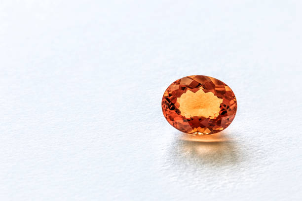 istock Beautiful citrine quartz crystal faceted on white surface 1241755729