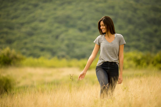 Free Stock Photo of Woman Standing in Field of Tall Grass | Download ...