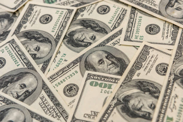 istock 100 one hundred us dollar banknotes as seamless texture and background for design 1241758459