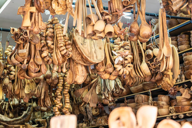 istock Traditional Cretan handmade olive wood kitchen tableware objects made of olive wood, souvenir market store. 1241763752