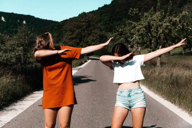 Photo of Dab Dance Middle of the Road Young Women Performing a DAB