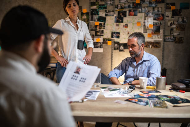 istock FBI detectives working hard late at night in office to solve murder case 1241789602