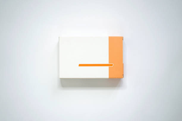 Orange and white medicine packaging carton ideal for mockup white background