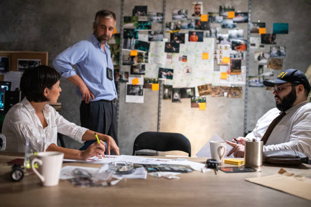 istock FBI team working together at office late at night to solve the case 1241791326