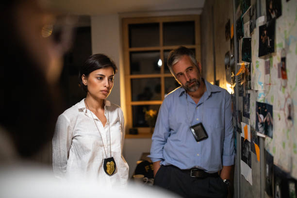 istock Detectives working extra hours to solve the case at office 1241792480