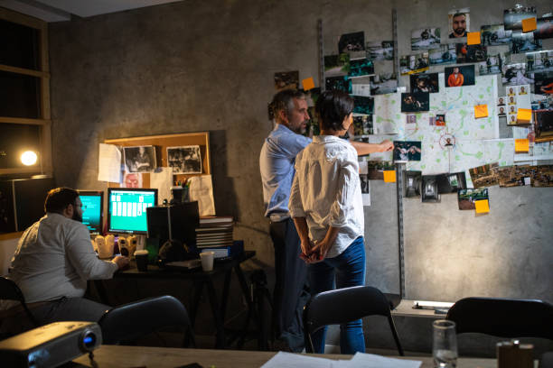 istock Detectives working extra hours to solve the case at office 1241793001