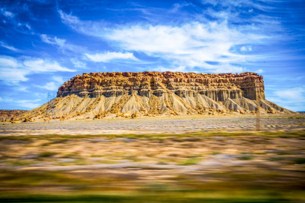 Three men amidst scenic landscape, Colorado, USA