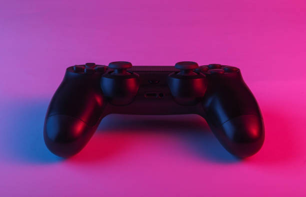 istock Gamepad with neon blue-pink light. Gaming concept. 1241812076