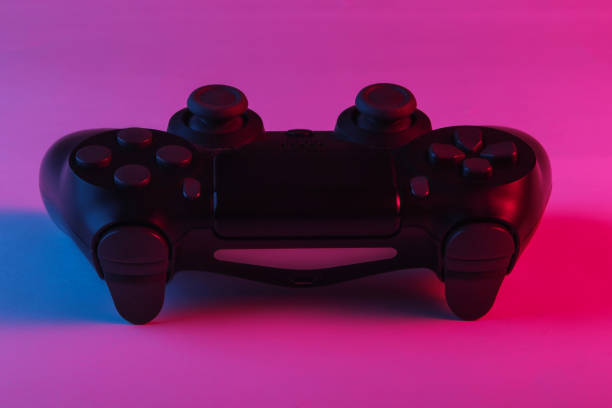 istock Gamepad with neon blue-pink light. Gaming concept. 1241812615
