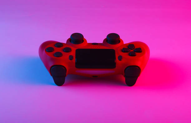 istock Gamepad with neon blue-pink light. Gaming concept. 1241812617