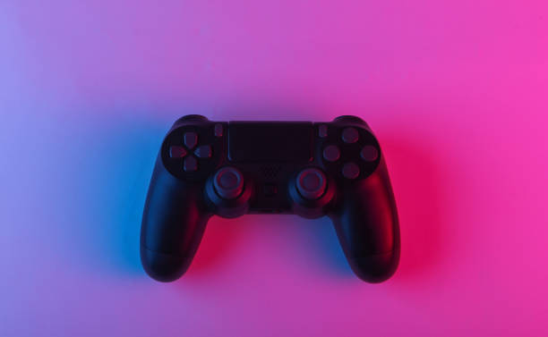 istock Gamepad with neon blue-pink light. Gaming concept. 1241812623