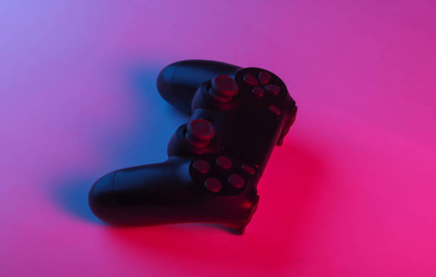 istock Gamepad with neon blue-pink light. Gaming concept. 1241812640