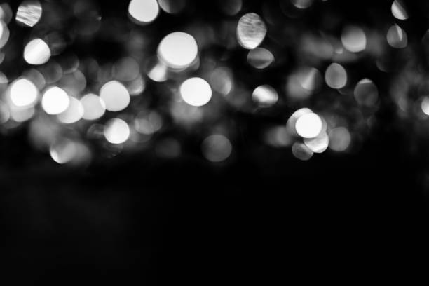 istock Black and white circles bokeh festive glitter dark background 1241817602