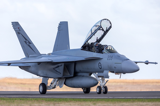 Avalon, Australia - February 28, 2013: Royal Australian Air Force (RAAF) Boeing F/A-18F Super Hornet multirole fighter aircraft A44-209 based at RAAF Amberley in Queensland taxiing at Avalon Airport.
