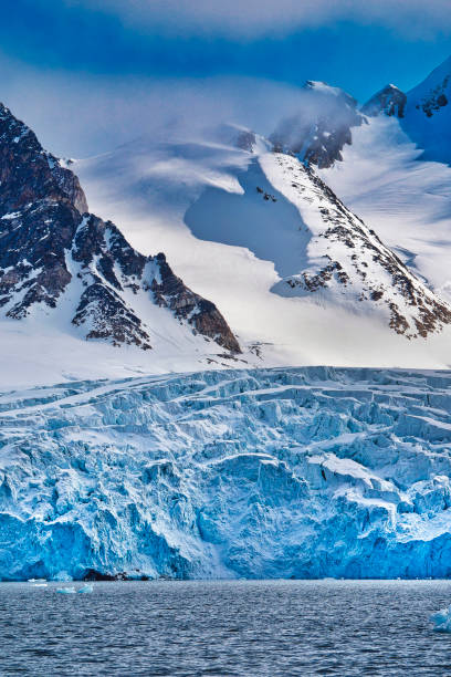 istock Deep Blue Glacier and Snowcapped Mountains 1241828710