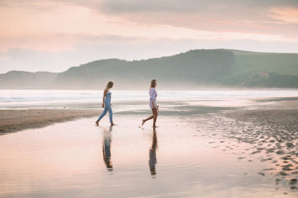 istock Two young women at the beach 1241829459