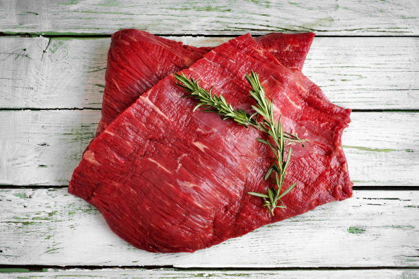 raw fillet of beef brisket on white wooden background raw fillet of beef brisket on white wooden background brisket photos stock pictures, royalty-free photos & images