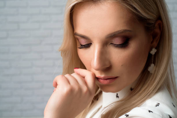 istock Young pretty woman wearing white shirt. Studio background. 1241832669