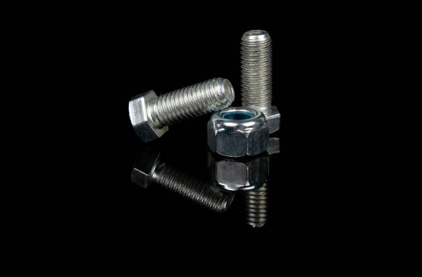 istock steel bolt and nut on black background 1241840859