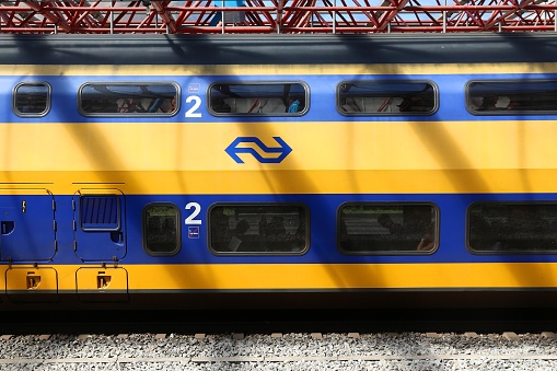 Nederlandse Spoorwegen (NS) train in Zaandam. NS is the principal Dutch public railway company, operating 4,800 domestic trains daily.