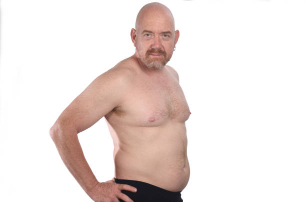 Portrait of a middle aged man portrait of a man shirtless on white background, fat guy no shirt stock pictures, royalty-free photos & images