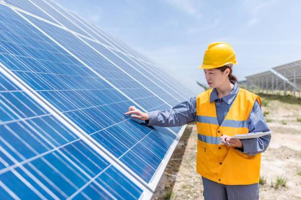 istock Asian female power engineer working at solar power station 1241860341