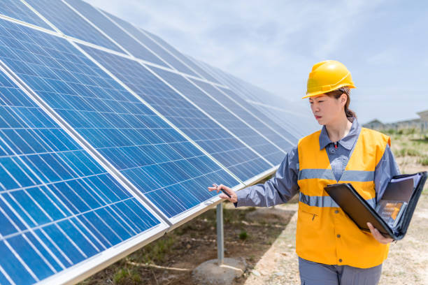 istock Asian female power engineer working at solar power station 1241861441