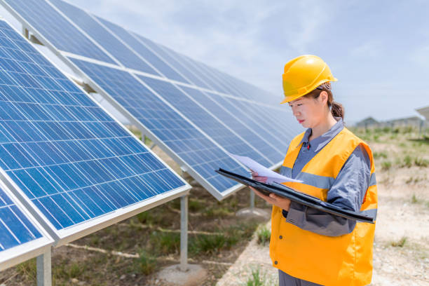 istock Asian female power engineer working at solar power station 1241862525