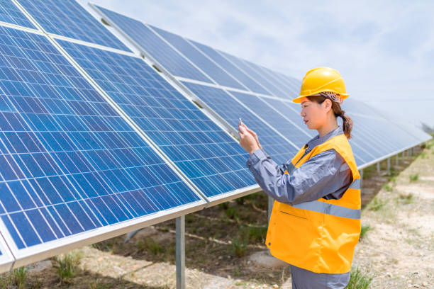 istock Asian female power engineer working at solar power station 1241863046