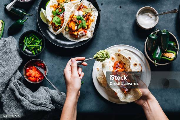 Woman Preparing Tasty Vegan Tacos Stock Photo - Download Image Now - Taco, Cooking, Veganism