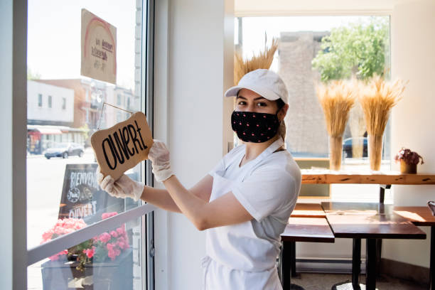 istock Owner opening her store with protective mesure againts Covid-19. 1241883136