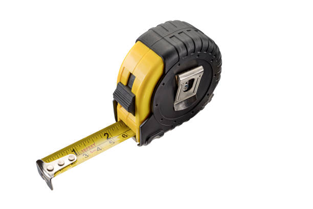 istock Single yellow and black tape measure, isolated over white 1241883435