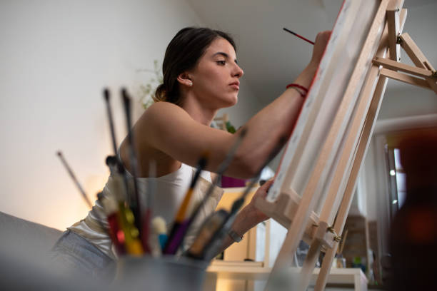 istock A young woman painting on a canvas 1241895123
