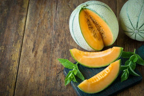 istock Juicy ripe melons on the wooden table 1241920912