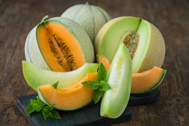 istock Juicy ripe melons on the wooden table 1241920913