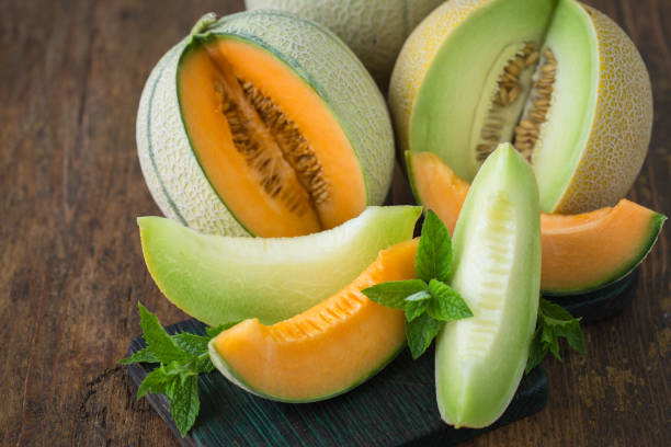 istock Juicy ripe melons on the wooden table 1241920937
