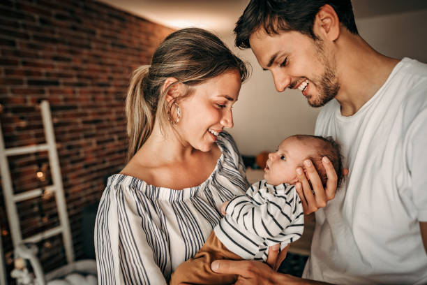 istock Parents holding their baby 1241924654