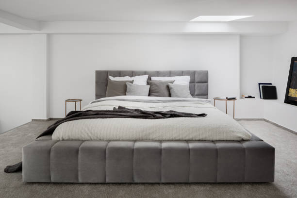 istock Big, gray and quilted bed 1241926757